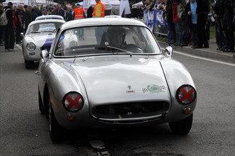 White classic racing car at an event with spectators in the background, SOLITUDE REVIVAL 2011,