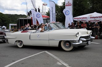 A white classic convertible saloon during a demonstration drive on a race track, SOLITUDE REVIVAL
