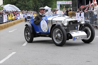 Blue classic car with driver in racing suit on a race track, SOLITUDE REVIVAL 2011, Stuttgart,