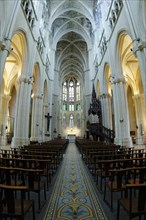 Church of Saint-Vincent-de-Paul, The interior of a church with a long central aisle leading to the