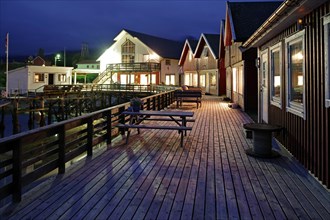 Wooden jetty with cosy wooden houses and benches, Rorbuer, holiday, fishing, Halsa, Kystriksveien,