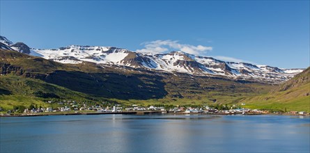 View over harbour and town Seyoisfjoerour along the fjord Seydisfjoerdur in summer, Eastern Region,