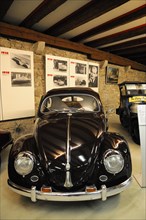 German Car Museum Langenburg, Black Volkswagen Beetle in a historic museum setting, German Car