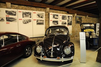 Deutsches Automuseum Langenburg, A black, classic Volkswagen Beetle parked in a historic exhibition