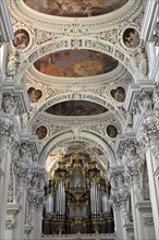 St Stephan Cathedral, Passau, View of the organ and ceiling frescoes inside a baroque church, St