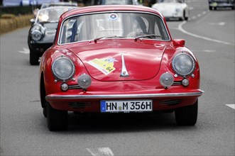 A red classic Porsche at a classic car race on the road, SOLITUDE REVIVAL 2011, Stuttgart,