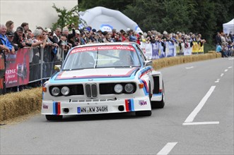 BMW racing car at a motorsport event with spectators in the background, SOLITUDE REVIVAL 2011,