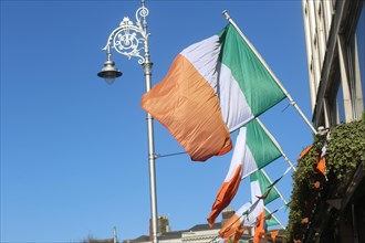 The Irish tricolour hanging in the breeze on a sunny day. Dublin, Ireland, Europe