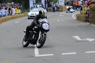 A motorcyclist during a race at speed on the track, SOLITUDE REVIVAL 2011, Stuttgart,