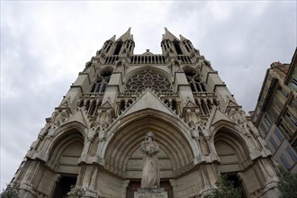 Church of Saint-Vincent-de-Paul, exterior view of a Gothic-style church with a statue in the