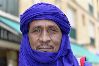Businessman from Morocco, close-up of a contemplative man in a blue turban, Marseille, Departement
