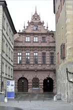 Town Hall, Pink coloured Renaissance facade of a historic building with elaborate decorations,