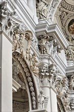 St Stephen's Cathedral, Passau, detail of baroque stucco work with sculptures in a church interior,