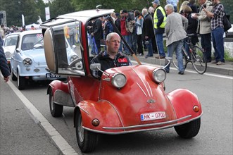 Red three-wheeler car with open top and driver, at an event, SOLITUDE REVIVAL 2011, Stuttgart,