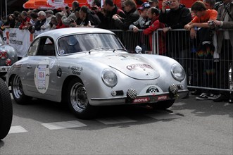A silver classic sports car is watched by spectators, SOLITUDE REVIVAL 2011, Stuttgart,