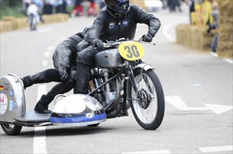 A motorcyclist on a classic racing motorbike in front of an eager audience, SOLITUDE REVIVAL 2011,
