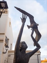 Bronze sculpture, boy catching a seagull, Olbia, Sardinia, Italy, Europe