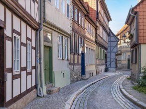 Narrow alley with half-timbered houses and cobblestones in the historic old town, UNESCO World