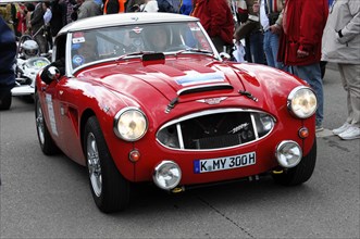 A red classic sports car on a race with spectators around, SOLITUDE REVIVAL 2011, Stuttgart,
