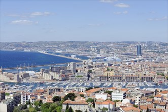 View of the busy harbour area of Marseille with city view and coastline, Marseille, Departement