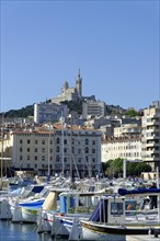 The old harbour, Vieux Port, behind the basilica Notre-Dame de la Garde, Marseille, A view of the
