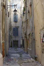 Marseille, Narrow alley in an old town with closed doors and shutters, Marseille, Departement