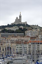 Marseille, View of Marseille with church on the hill and harbour in the foreground, Marseille,
