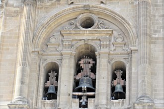 Granada, Bells in the opening of the church facade in front of a clear sky, Granada, Andalusia,