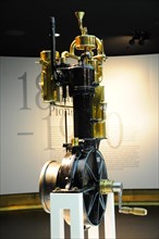 Exhibited old engine model made of brass represents the early technological development,