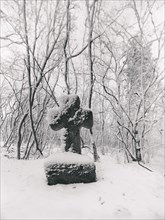 Medieval stone cross in a snow-covered forest in winter, murder cross, atonement cross, Freyburg
