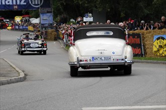 Rear view of a white Mercedes classic car on a rally road, SOLITUDE REVIVAL 2011, Stuttgart,