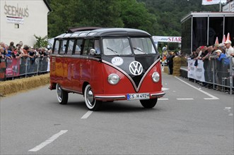VW Samba Bus, built in 1953, red Volkswagen bus from the side perspective at the classic car race,