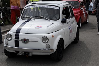 A small white Fiat 500 with race number in front of spectators, SOLITUDE REVIVAL 2011, Stuttgart,