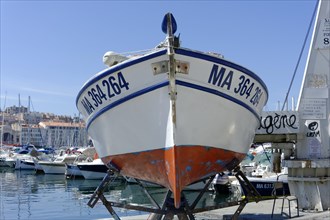 Marseille harbour, A boat in dry dock with a view of the harbour in the background, Marseille,