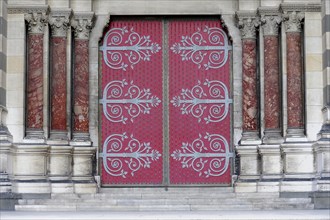 Marseille, Large red door with elaborate decorations on a historic building, Marseille, Departement