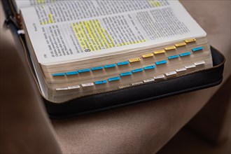 Open Bible with yellow and blue bookmark on a black book cover, Bibelkreis, Jesus Grace Chruch,