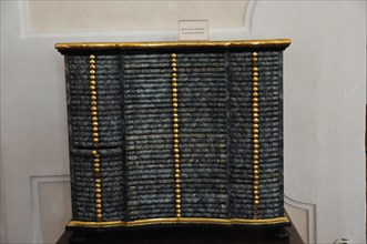 Langenburg Castle, Black antique chest of drawers with gold-coloured accents and textured surface,