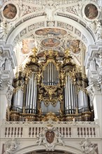 St Stephan's Cathedral, Passau, Detailed baroque organ with gold-coloured decorations in the church