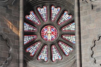 Speyer Cathedral, Illuminated rose window in a Gothic church, its colourful splendour reflected in