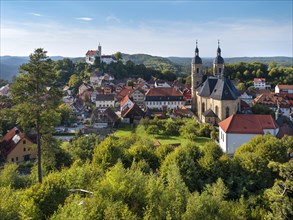 View of Goessweinstein with castle, pilgrimage church and half-timbered houses, Franconian
