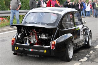 A black classic racing car with open tailgate shows the engine, SOLITUDE REVIVAL 2011, Stuttgart,