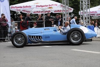 A blue classic racing car on a race track surrounded by spectators, SOLITUDE REVIVAL 2011,