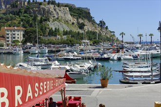 Cassis, the harbour, A lively harbour with restaurants on the waterfront and boats in the water,