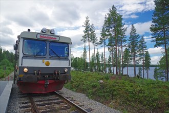 An Inlandsbanan diesel train at a lake, Railway, Inland railway, Sweden, Europe