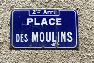 Marseille, Worn blue street sign with the inscription 'PLACE DES MOULINS' on a wall, Marseille,