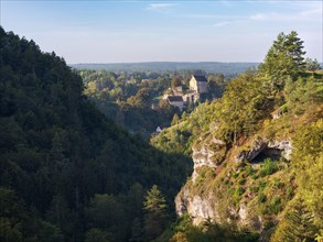 View of the Puettlach valley with rocks, forests and Pottenstein Castle, Franconian Switzerland,
