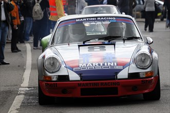A Porsche in Martini Racing design stands ready on a race track, SOLITUDE REVIVAL 2011, Stuttgart,
