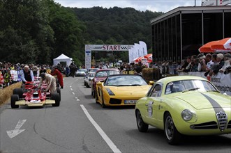 A gathering of sports cars and spectators at a racing event, SOLITUDE REVIVAL 2011, Stuttgart,