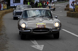 Silver Jaguar E-Type on the road at a classic car race, SOLITUDE REVIVAL 2011, Stuttgart,