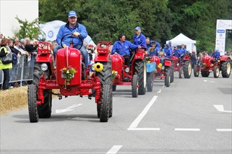 Porsche Diesel tractors, in a parade, driven by people in blue overalls, SOLITUDE REVIVAL 2011,